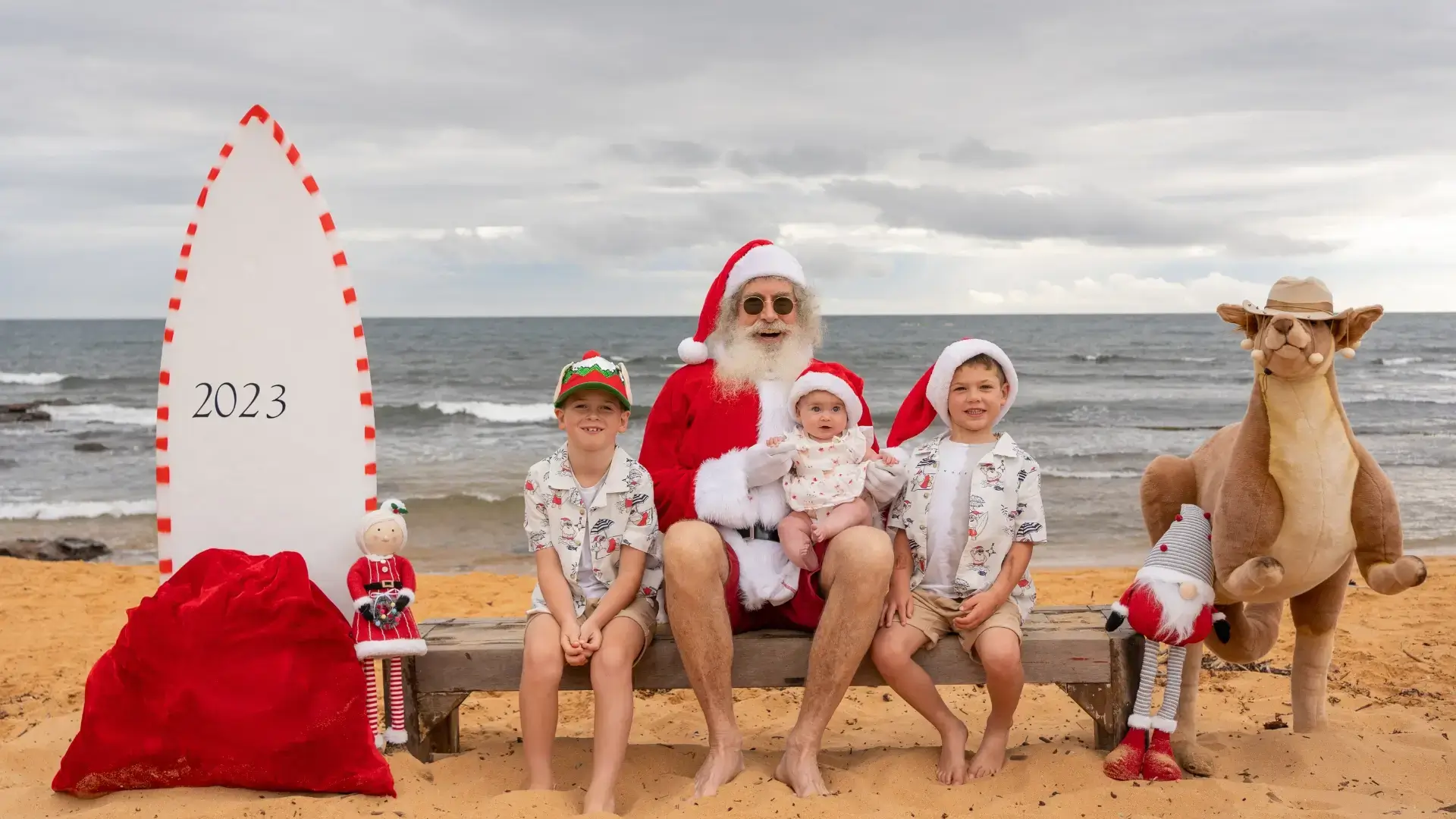 Photo of santa with 3 kids at Collaroy Beach, NSW